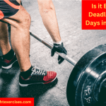 A Man's Legs and a Loaded Barbell on the Floor. He is Preparing to Deadlift