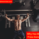 A Muscular Man Performing Bench Press