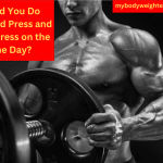 A Muscular Man Putting a Weight Plate onto a Barbell