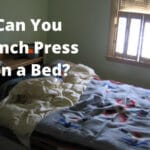 Can You Bench Press on a Bed