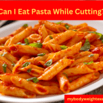 A plate of pasta and tomato sauce