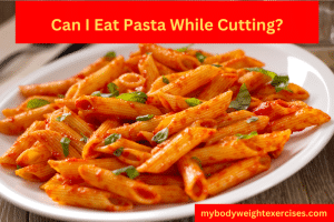 A plate of pasta and tomato sauce