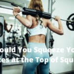 Should You Squeeze Your Glutes at the Top of Squats