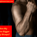 A Man Tensing His Arm Showing Off His Forearm