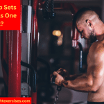 A Muscular Man Performing Cable Bicep Curls