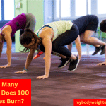 A Group of People in a Fitness Class Performing Burpees