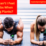 An Athletic Couple Performing a Plank