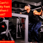 A Man Performing Barbell Squats in the Squat Rack in the Gym